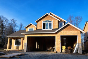 Garage door openings in new construction home being built.