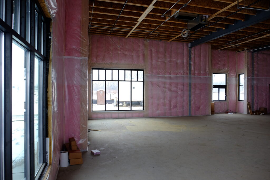 Insulated room with pink fiberglass walls